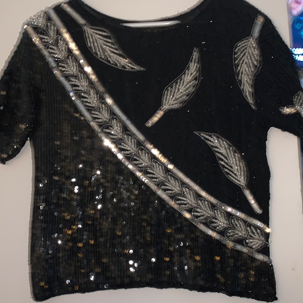 J.L.B Medium Black top with black and silver beads and sequins. Short sleeved.
